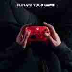 Microsoft Xbox Pulse Red Wireless Controller being used during gameplay, showcasing the ergonomic design and comfortable grip.