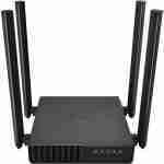 Three-quarter perspective studio view of the matte black TP-Link AC1200 dual-band router featuring four upright high-gain external antennas and front LED indicators.