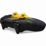 Side perspective view of the PlayStation 5 DualSense Marvel's Wolverine Limited Edition controller showcasing yellow thumbsticks and claw mark artwork.